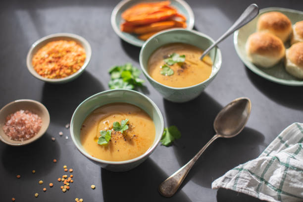 istock Orange and yellow lentil soup puree with fresh cilantro 1160613270
