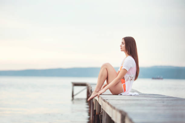 istock Beautiful young woman looking away alone 1160614211