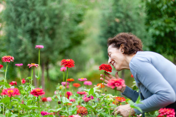 Woman smelling flower