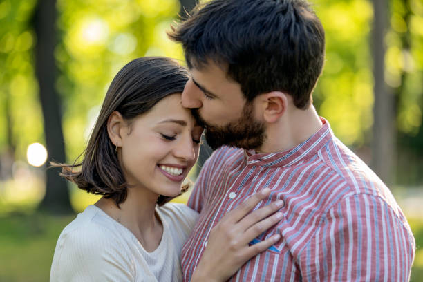 istock Romantic young couple having fun in the park. 1160615011
