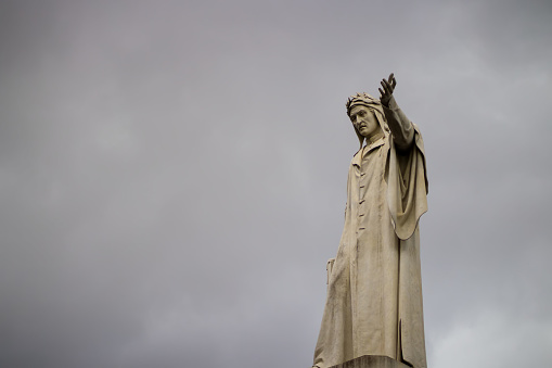 statue of Dante in Naples and clouds