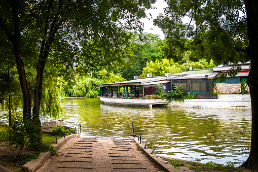 Bucharest, Romania - june 20 2019: Cismigiu Park with small lake in center of Bucharest, capital of Romania
