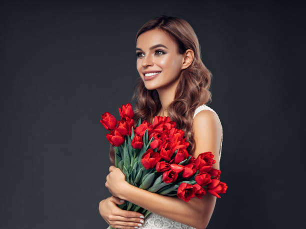 istock Beautiful woman with flowers 1160619246