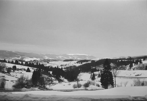 bnw immage of snow and Asiago itlain alps in the sunrise