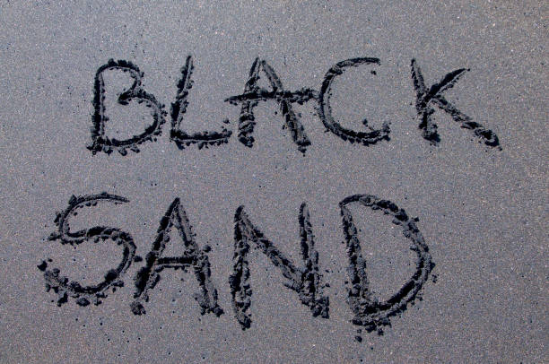 istock Black sand inscription drawn on black sand 1160621818