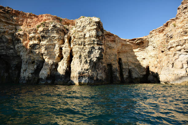 istock High cilfs with caves on Cominotto Island 1160622112