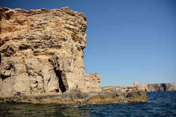 istock High cilfs with caves on Cominotto Island 1160622315