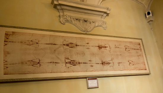 Turin, Italy, June 27, 2019:  A replica of the Turin Shroud in the Cathedral of St. John the Baptist in Turin. Italy