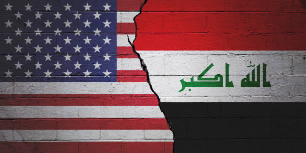 USA vs Iraq Cracked brick wall painted with a American flag on the left and a Iraqi flag on the right. iraqi flag stock pictures, royalty-free photos & images