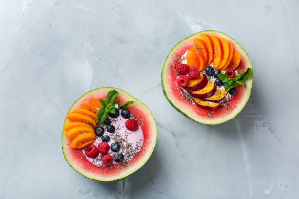 istock Healthy summer breakfast with fruit salad and yogurt in watermelon 1160623720