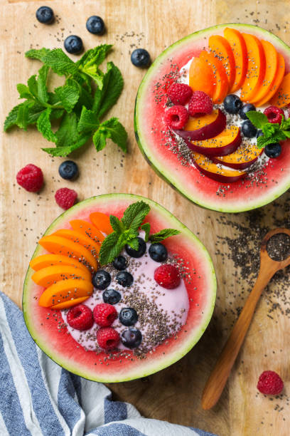 istock Healthy summer breakfast with fruit salad and yogurt in watermelon 1160623744