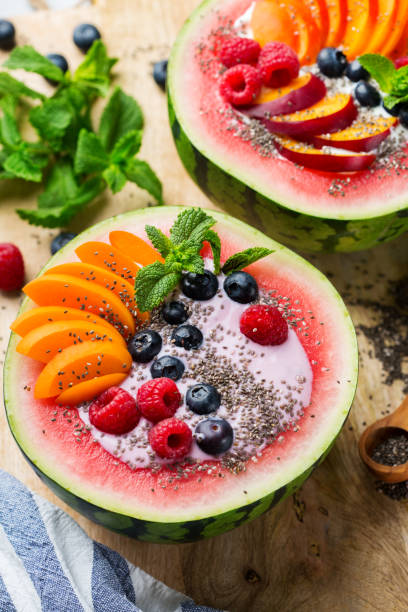 istock Healthy summer breakfast with fruit salad and yogurt in watermelon 1160623779