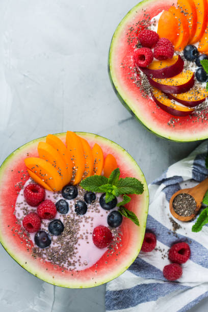 istock Healthy summer breakfast with fruit salad and yogurt in watermelon 1160623783