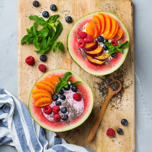 istock Healthy summer breakfast with fruit salad and yogurt in watermelon 1160623793