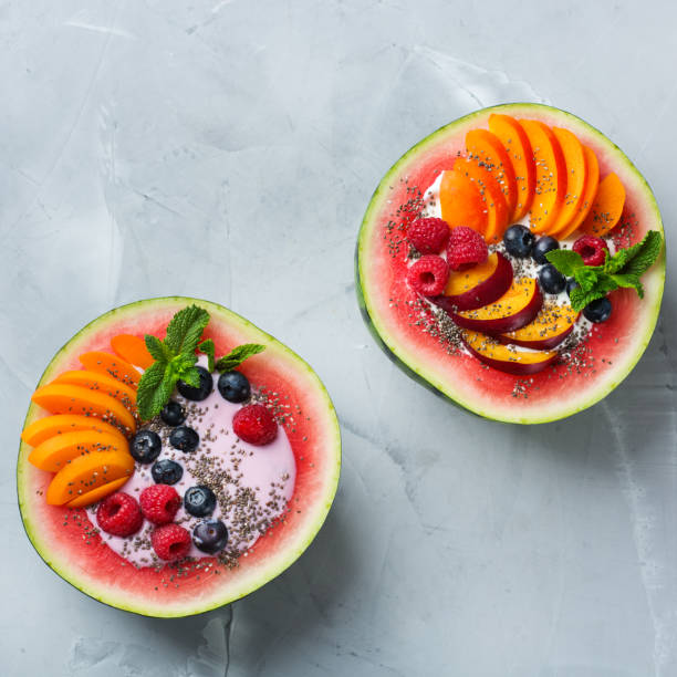 istock Healthy summer breakfast with fruit salad and yogurt in watermelon 1160623826