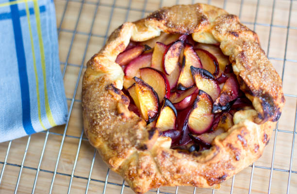 istock Rustic Homemade Plum Tart/Galette on Cooling Rack 1160624486