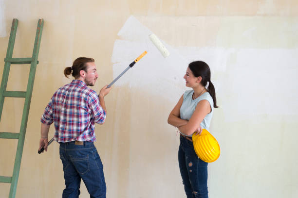 istock Beautiful young couple making redecoration at home. 1160624834