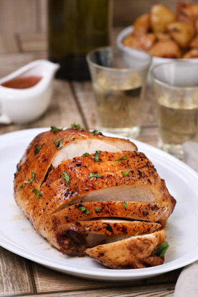 istock Sliced into slices baked turkey breast  close-up at the dinner table 1160627802