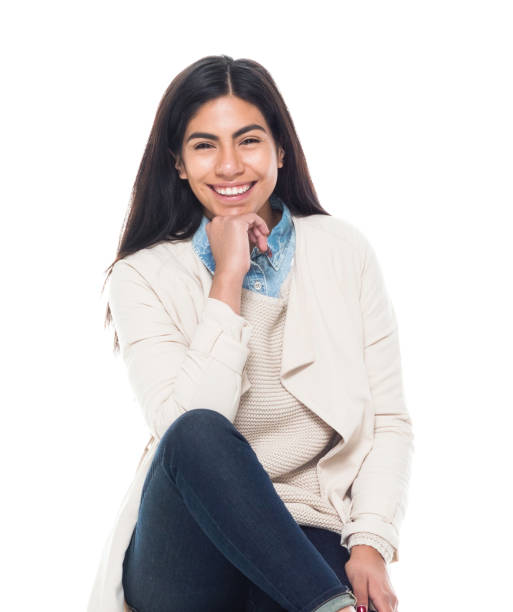 istock Attractive young latino female is sitting 1160630423