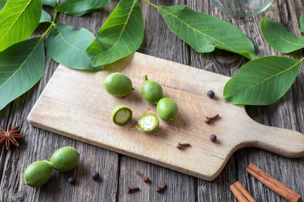 istock Cutting up unripe walnuts to prepare a homemade nut liqueur 1160631074