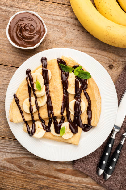 istock Crepes with banana and chocolate sauce 1160631122