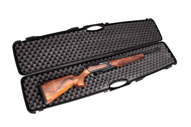 istock Modern semi-automatic hunting rifle with a wooden butt in an open plastic case. Isolate on a white background. 1160633183