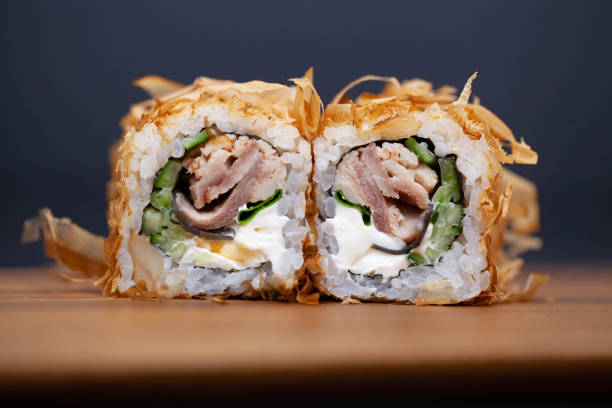 istock Japanese Sushi roll with salmon and cucumber on dark background 1160633675