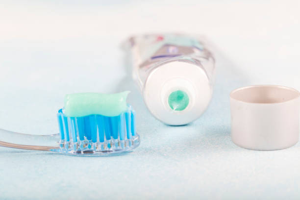 istock toothbrush on the table with toothpaste and toothpaste tube on blurred background. 1160635333