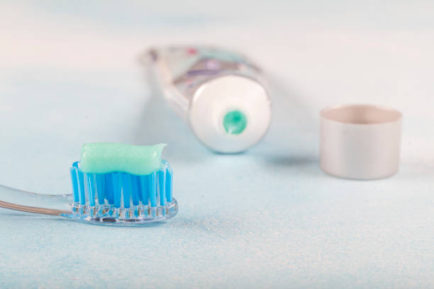 istock toothbrush on the table with toothpaste and toothpaste tube on blurred background. 1160635530