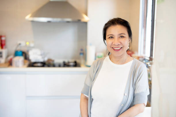 istock Senior Asian woman in the kitchen 1160636393