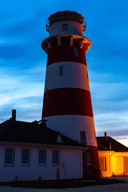istock lighthouse on the sea at sunset 1160636429