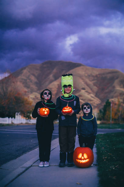istock Young Children Holding Jack O' Lanterns for Halloween 1160636760