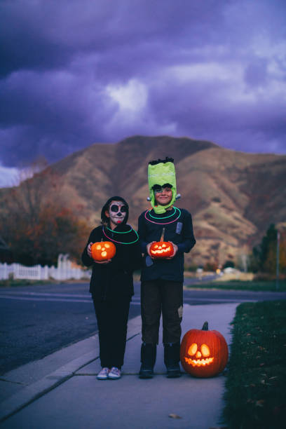 istock Young Children Holding Jack O' Lanterns for Halloween 1160636766