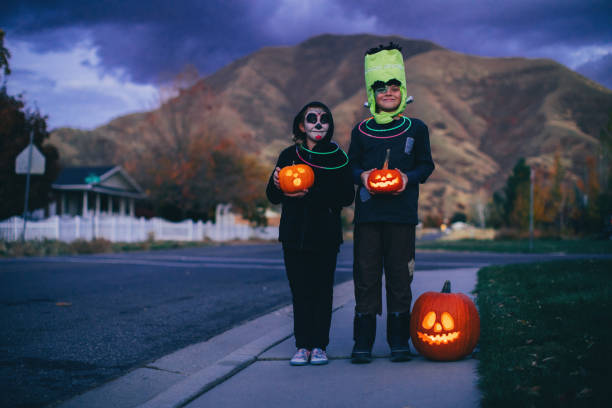 istock Young Children Holding Jack O' Lanterns for Halloween 1160636772