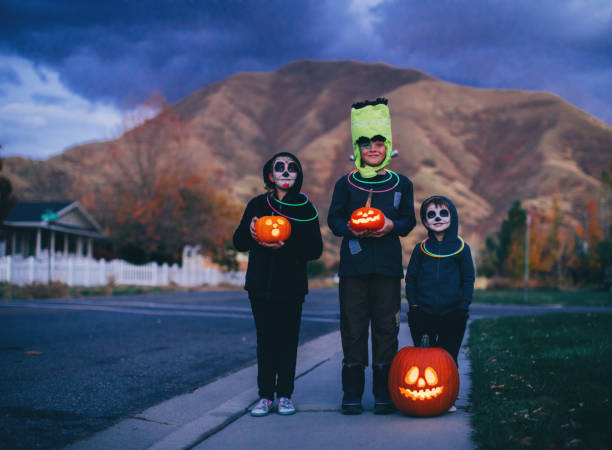 istock Young Children Holding Jack O' Lanterns for Halloween 1160636775