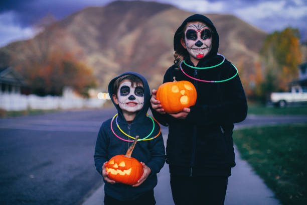 istock Young Children Holding Jack O' Lanterns for Halloween 1160636907