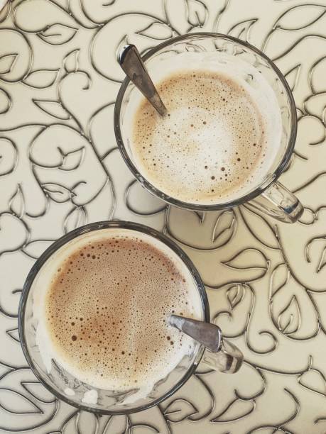 istock Overhead view of 2 cups of white coffee 1160641489