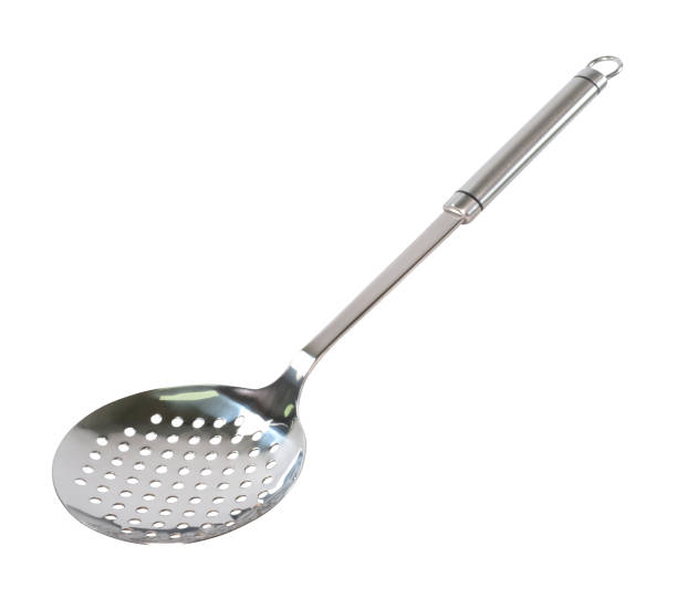 Stainless steel round kitchen skimmer isolated on white background.