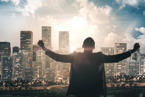 Businessman cheering achievement in downtown Beijing