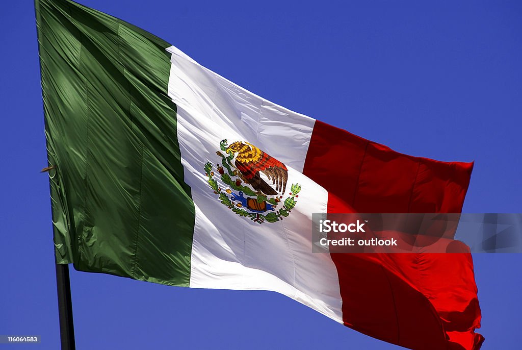 Mexican flag at full mast waving in the wind Flag from Mexico Aztec Civilization Stock Photo