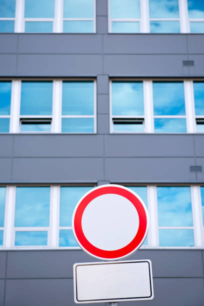 Bright yellow road sign against  bright blue sky. \n Road sign  made with retroreflective sheeting materials. Topic - road safety, road signs