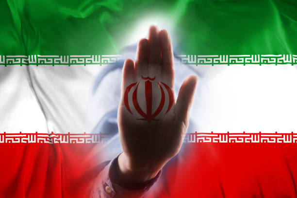 istock IRAN FLAG with hand STOP SIGN / Flag concept (Click for more) 1160646786