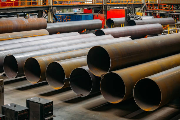istock Black steel pipes in warehouse 1160647504