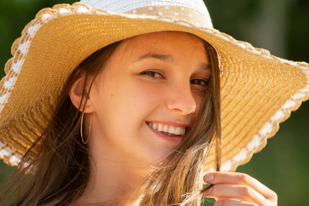 istock pretty girl in sun hat 1160648237