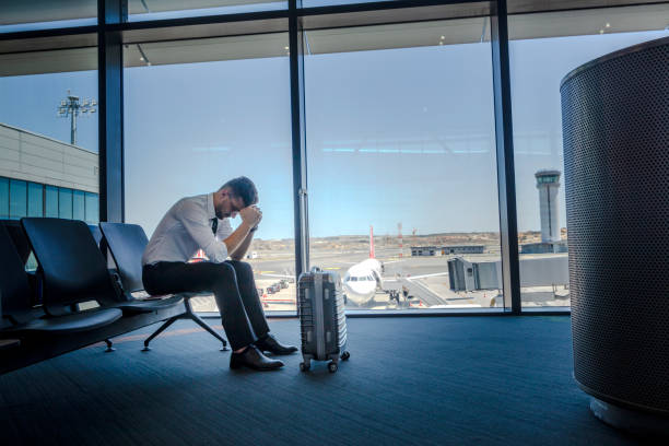istock Unhappy passenger waits for flight at airport 1160650051