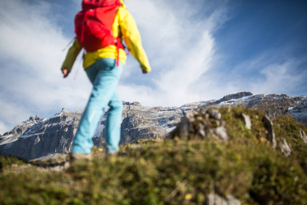 istock Pretty, young female hiker walking in high mountains 1160653915