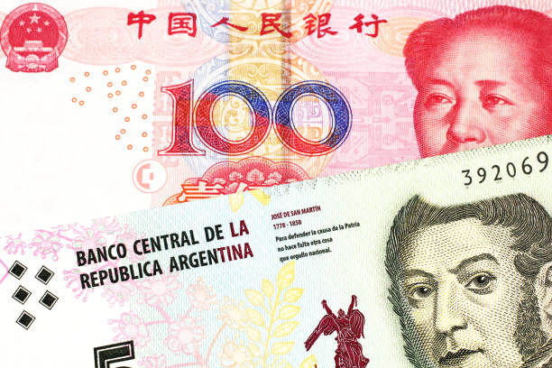 istock A peso note from Argentina, close up with a Chinese, yuan bill 1160654693