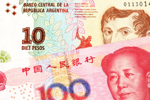 istock A peso note from Argentina, close up with a Chinese, yuan bill 1160656569