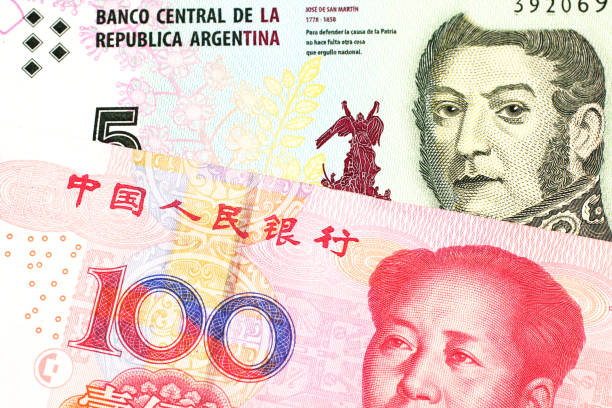 istock A peso note from Argentina, close up with a Chinese, yuan bill 1160656592