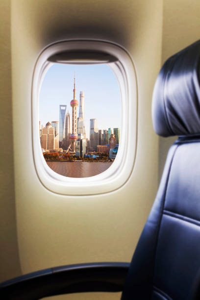 istock Airplane passenger empty seat and window view to Pudong District Shanghai 1160658164